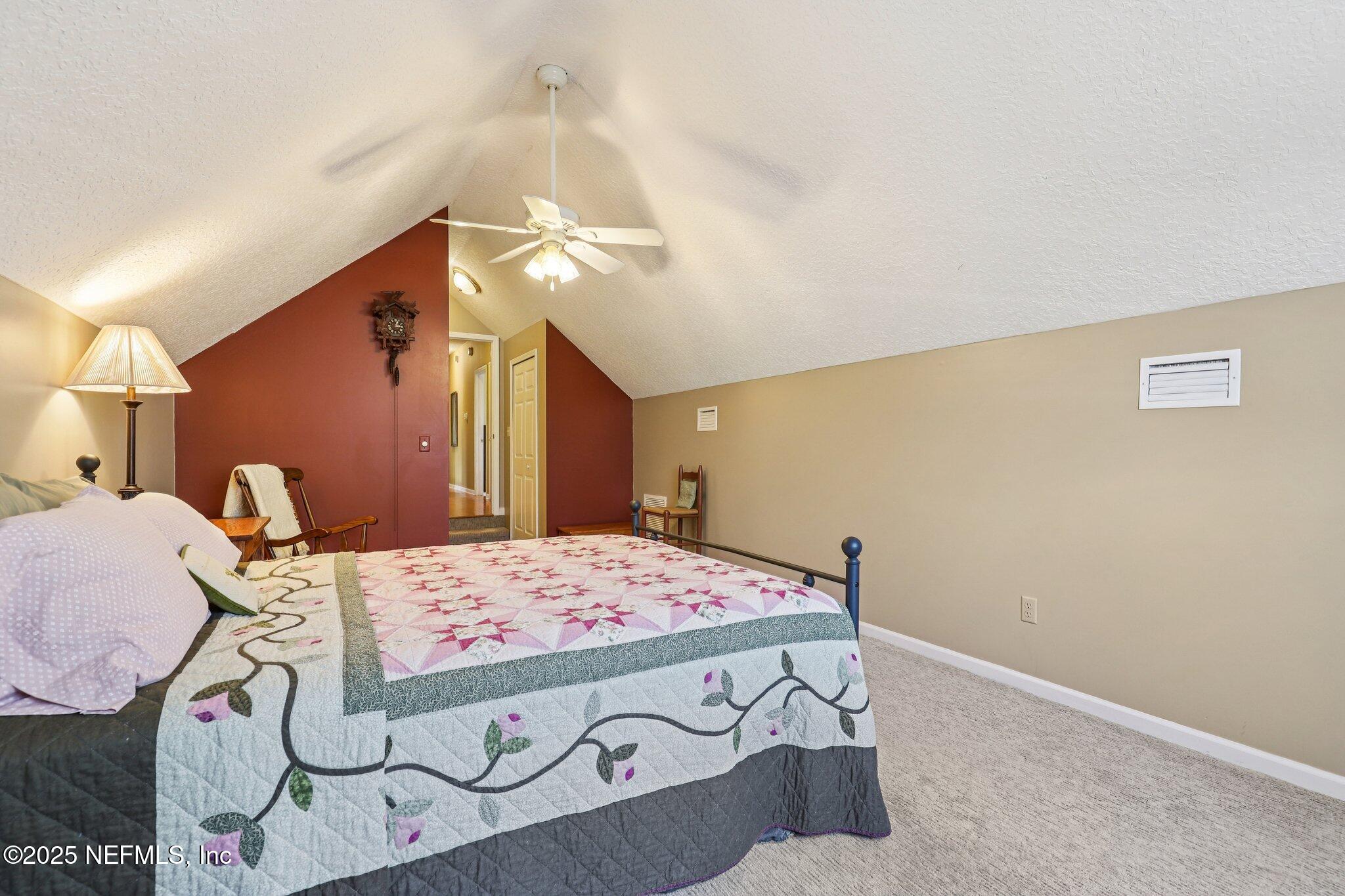 1432 Course View Drive Fleming Island, FL 32003 - Photo 39 of 83 a bedroom with a bed and a dresser