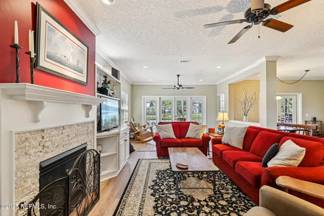 a room with pool table and windows