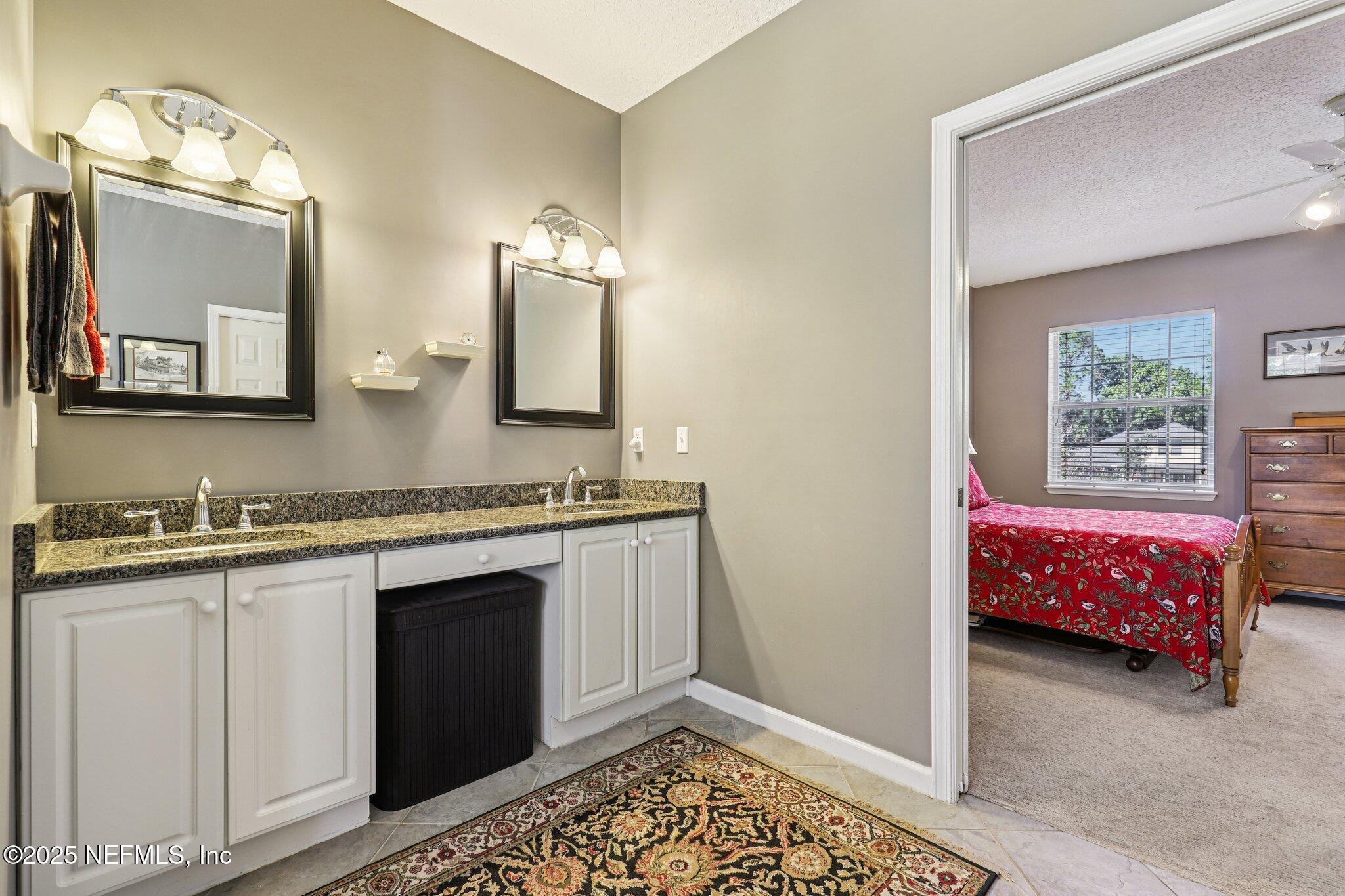 1432 Course View Drive Fleming Island, FL 32003 - Photo 48 of 83 a bathroom with a sink and a mirror