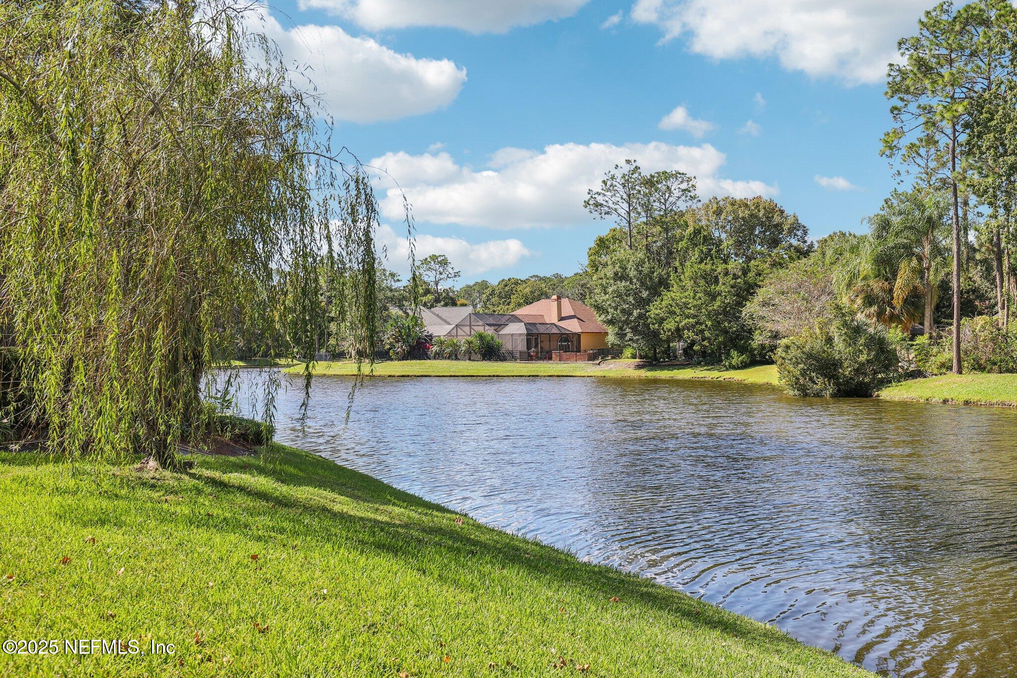 1432 Course View Drive Fleming Island, FL 32003 - Photo 58 of 83 a view of a lake with a yard
