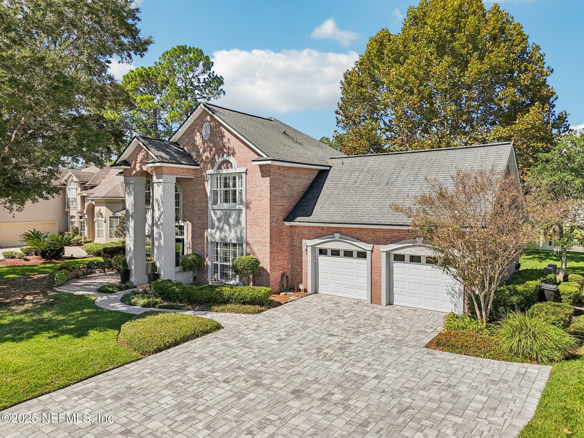 1432 Course View Drive Fleming Island, FL 32003 - Photo 60 of 83 front view of a house with a yard and an trees