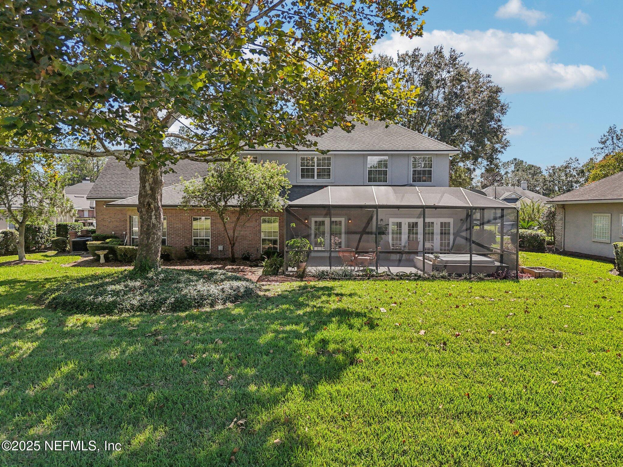 1432 Course View Drive Fleming Island, FL 32003 - Photo 68 of 83 a front view of house with yard and outdoor seating