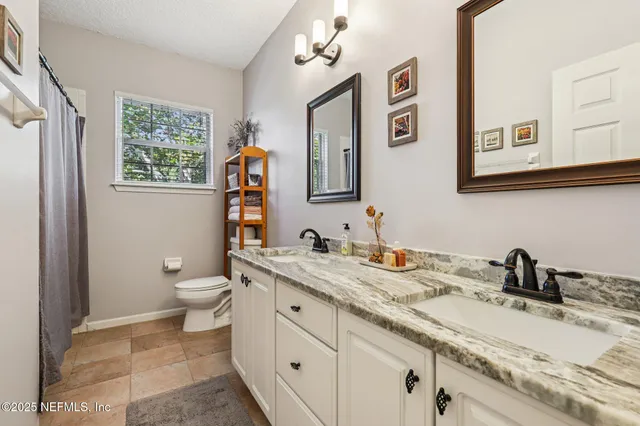 a view of a swimming pool with a patio and a yard