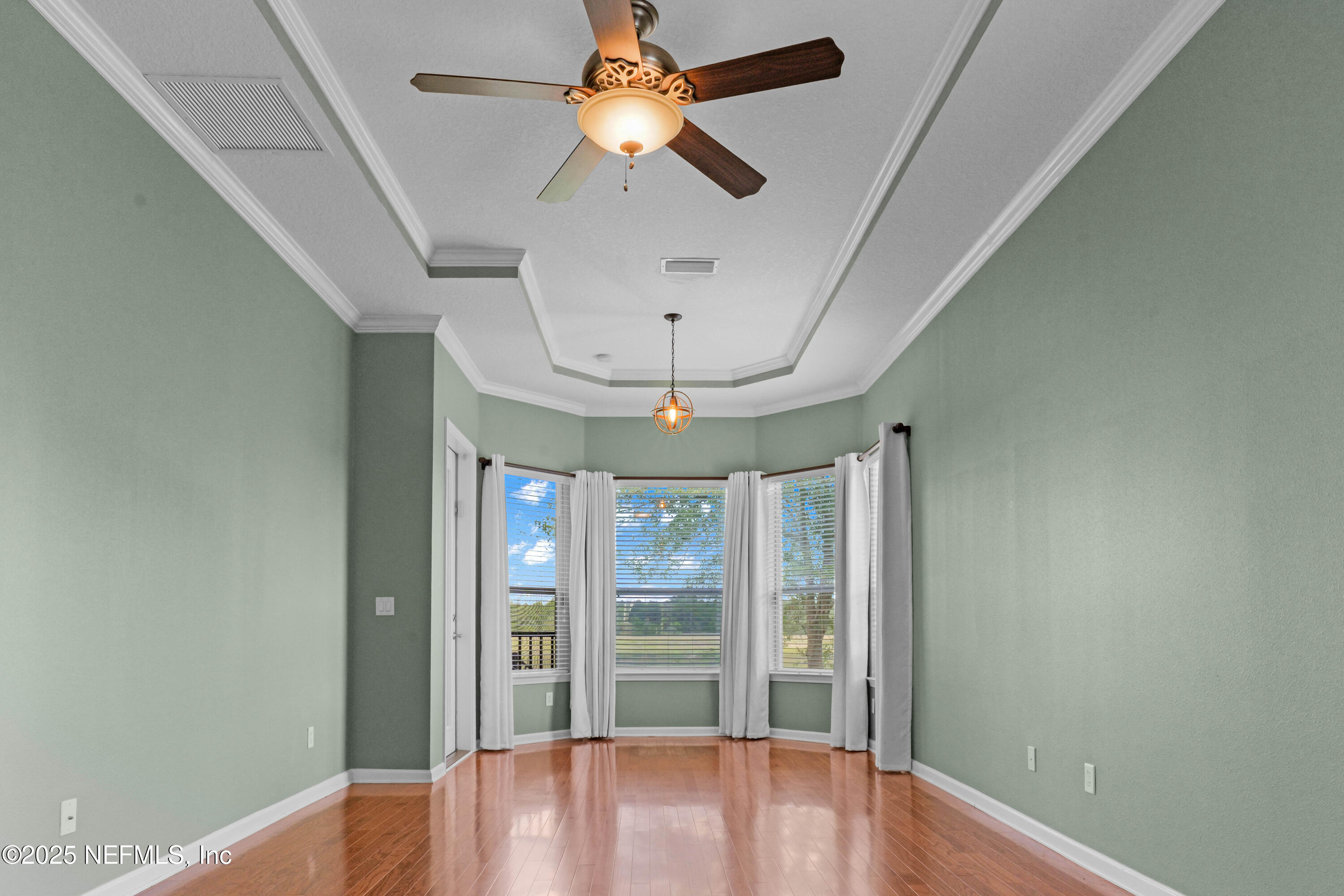 96218 Windsor Drive Yulee, FL 32097 - Photo 20 of 53 a view of room with window and wooden floor