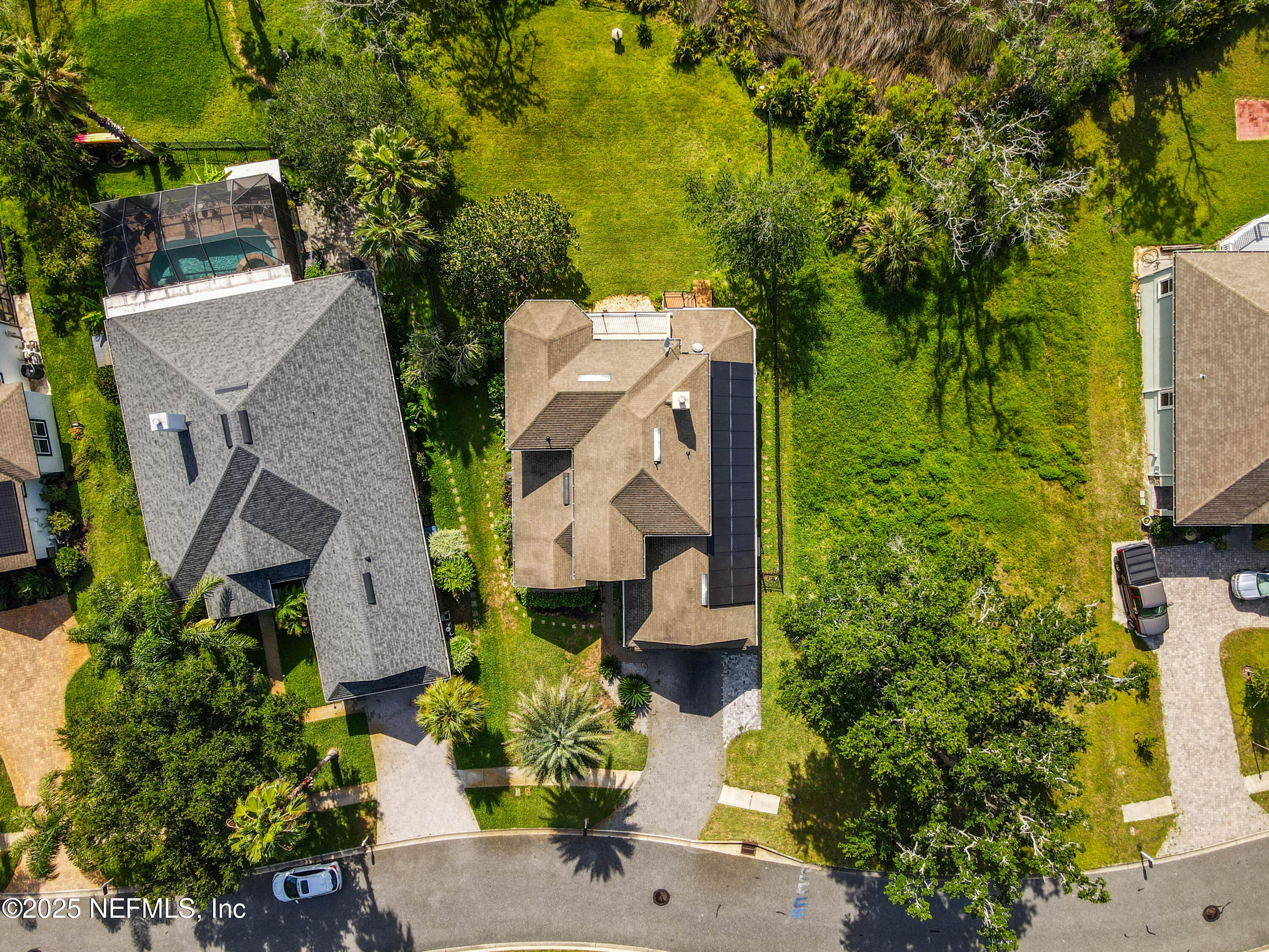96218 Windsor Drive Yulee, FL 32097 - Photo 31 of 53 an aerial view of residential house with outdoor space and trees all around