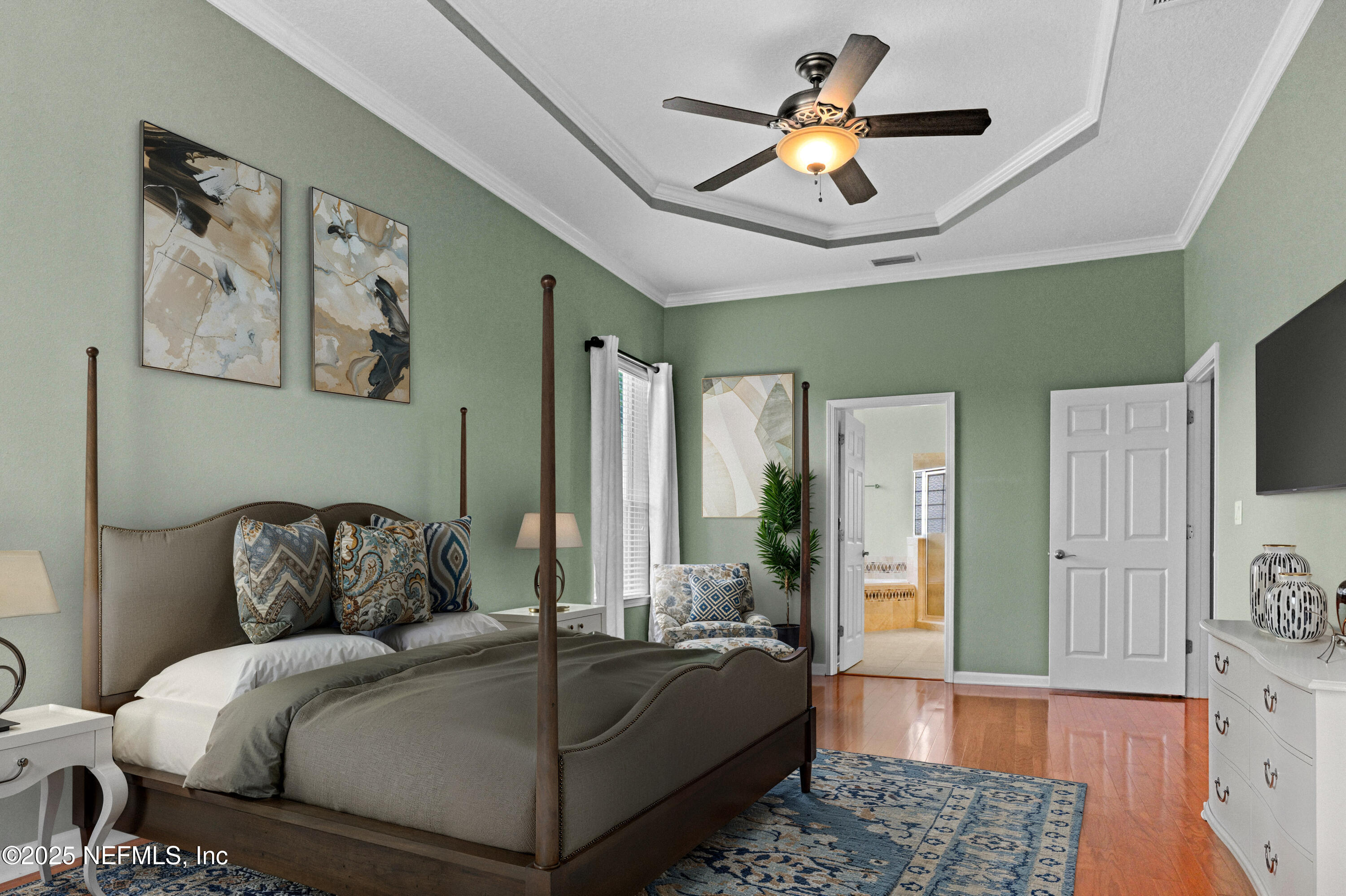 96218 Windsor Drive Yulee, FL 32097 - Photo 37 of 53 a bedroom with a bed and a chandelier