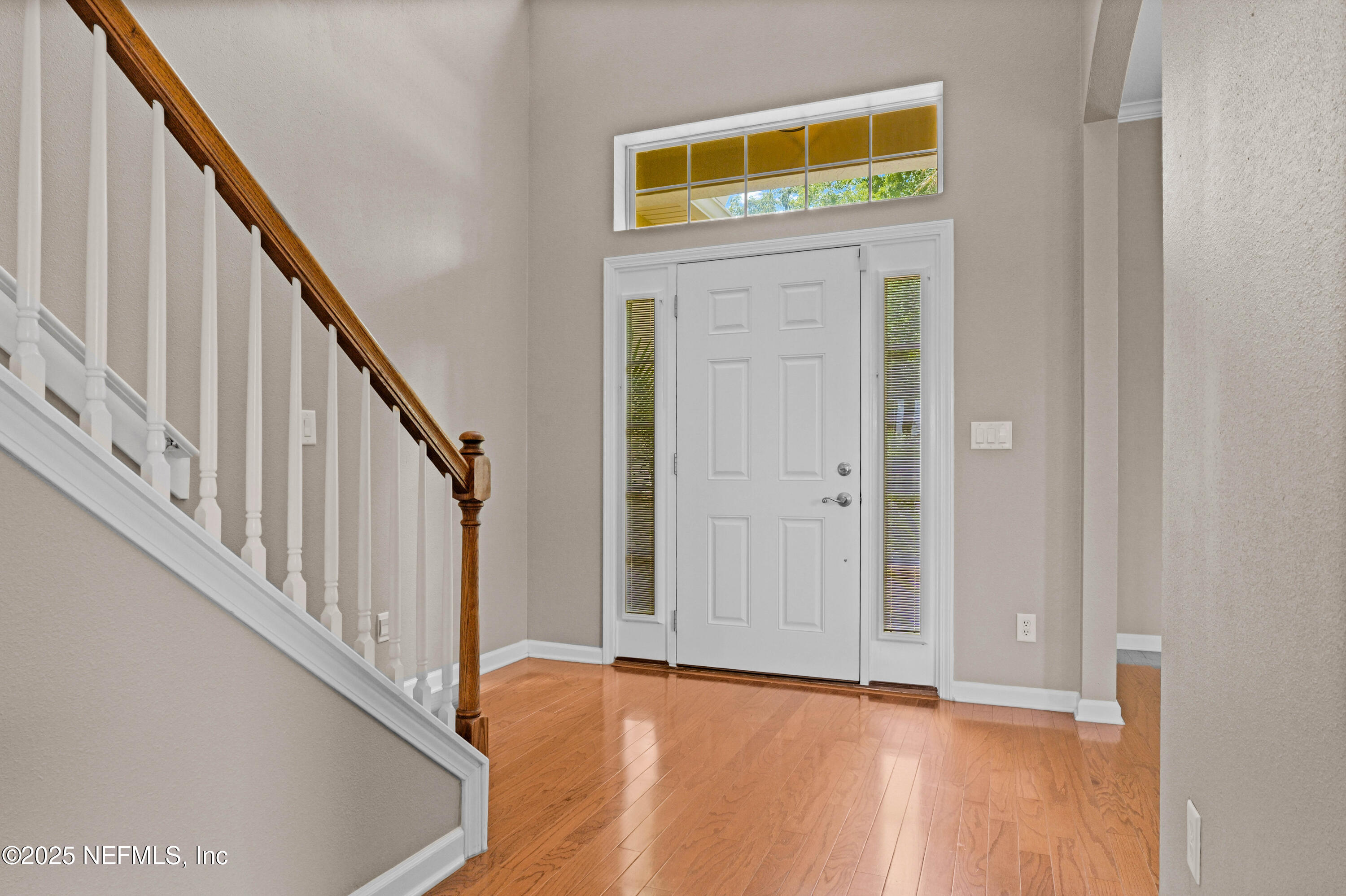 96218 Windsor Drive Yulee, FL 32097 - Photo 4 of 53 a view of an entryway with wooden floor