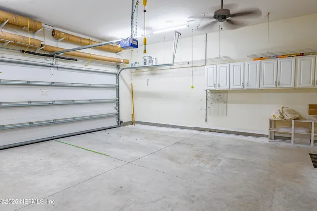 a bathroom with a sink vanity mirror and toilet