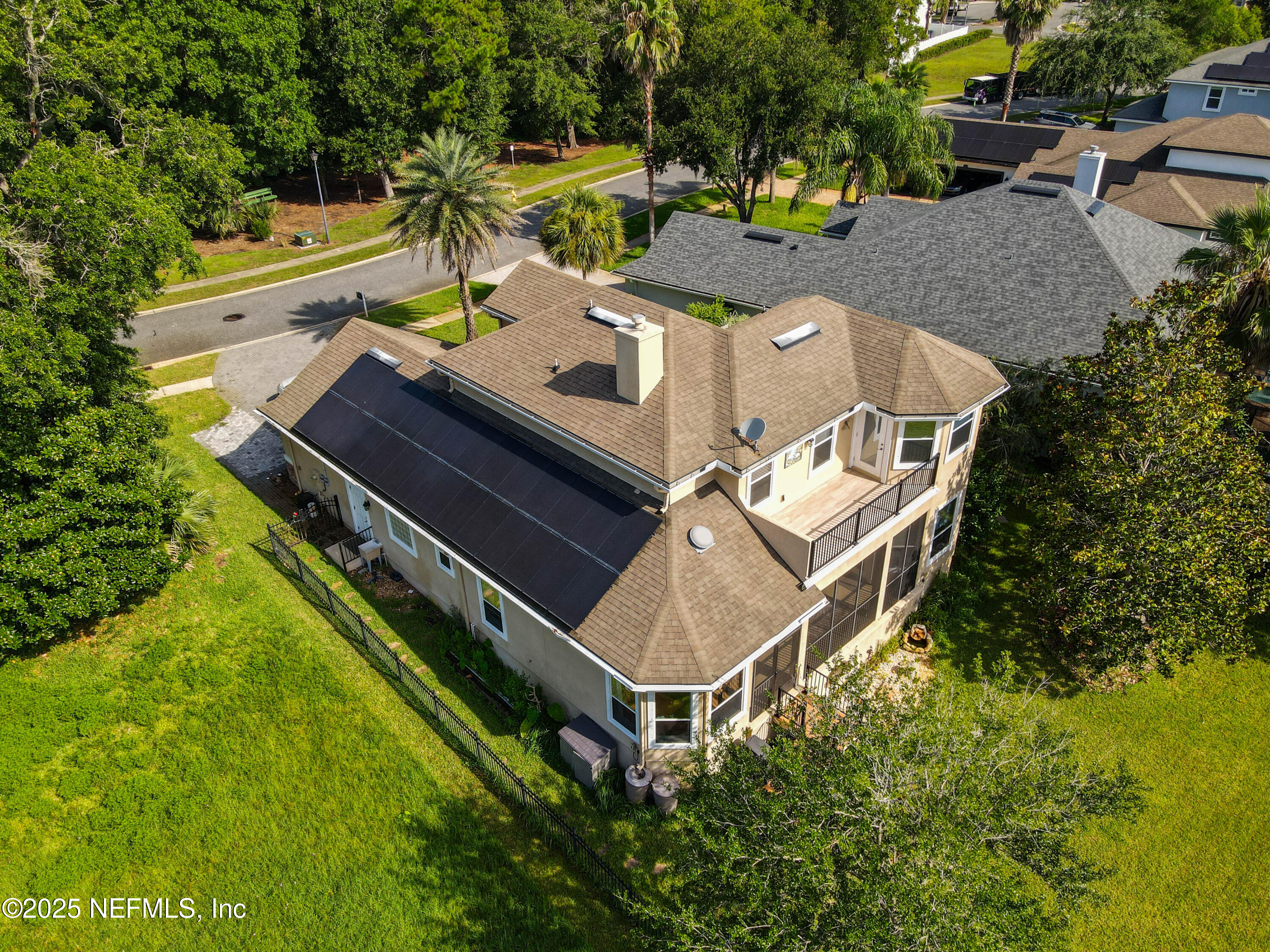 96218 Windsor Drive Yulee, FL 32097 - Photo 50 of 53 an aerial view of a house with swimming pool and outdoor space