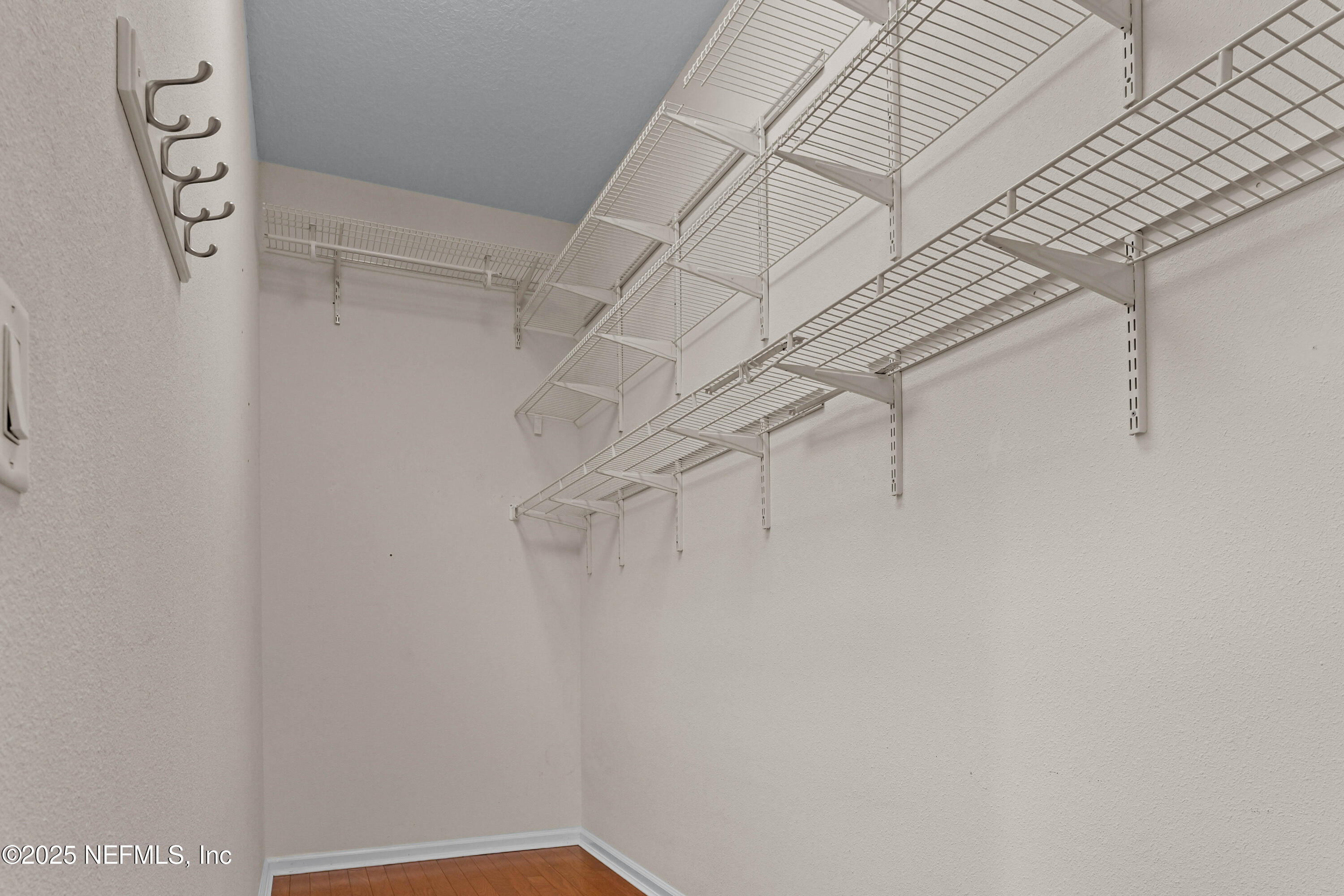 96218 Windsor Drive Yulee, FL 32097 - Photo 51 of 53 a view of a room with racks on the wall