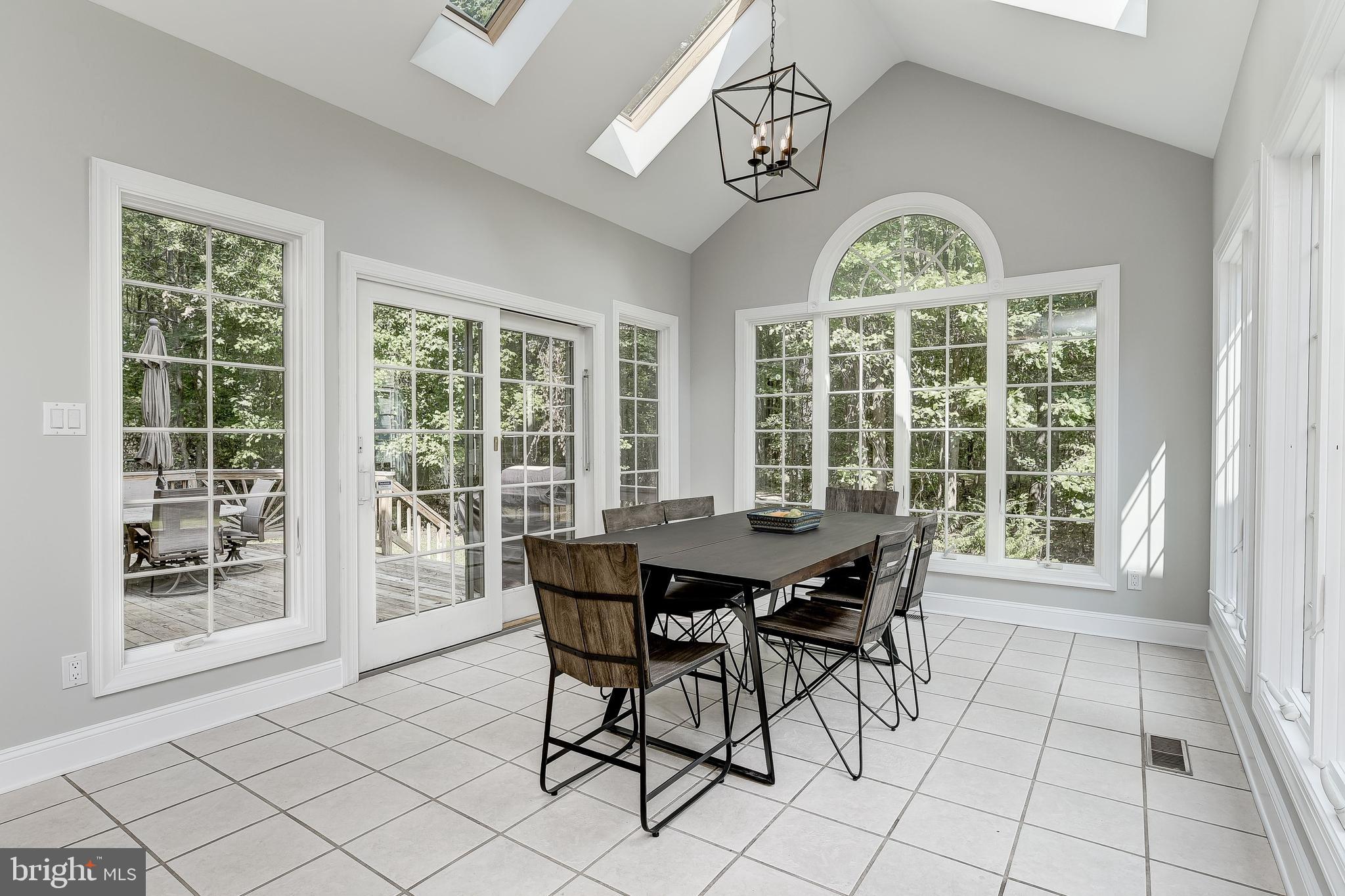 8222 Ventnor Road Pasadena, MD 21122 - Photo 14 of 46 Atrium windows and access to terrace