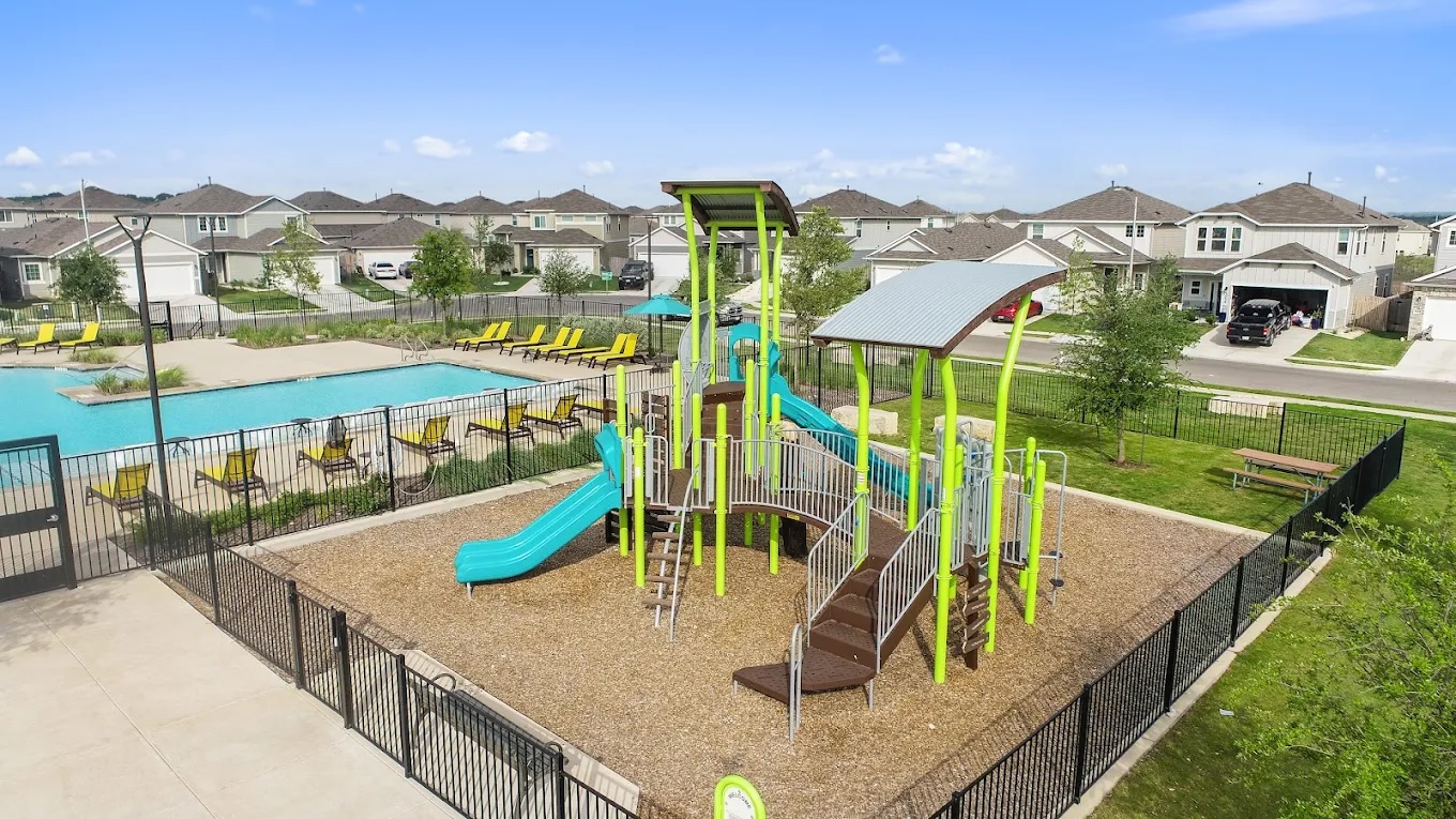 10700 Sentinel Drive Austin, TX 78747 - Photo 28 of 28 Community amenity center with pool and playscape.