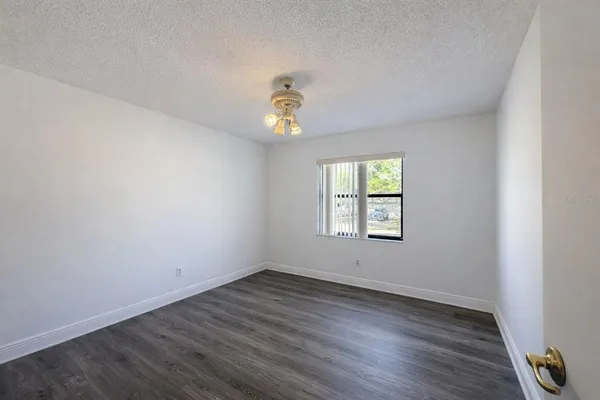 a view of empty room with floor to ceiling window