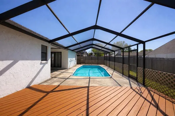 a view of a swimming pool with a patio