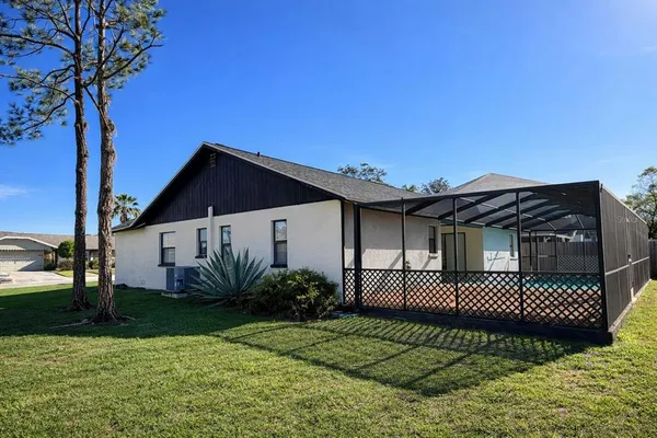 a view of a house with a yard and plants