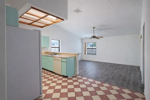 a kitchen with a cabinets and white stove