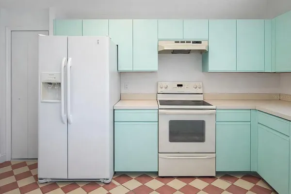 a view of a kitchen with a sink and a window