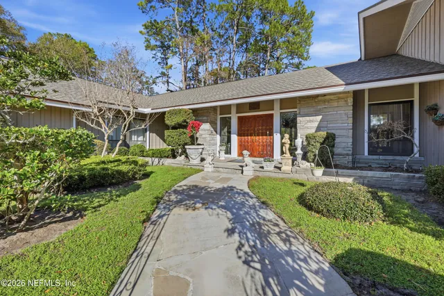 a lobby with furniture and wooden floor