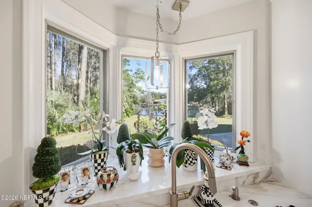 a kitchen with kitchen island granite countertop lots of counter top space and appliances
