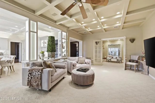 a lobby with furniture and floor to ceiling window