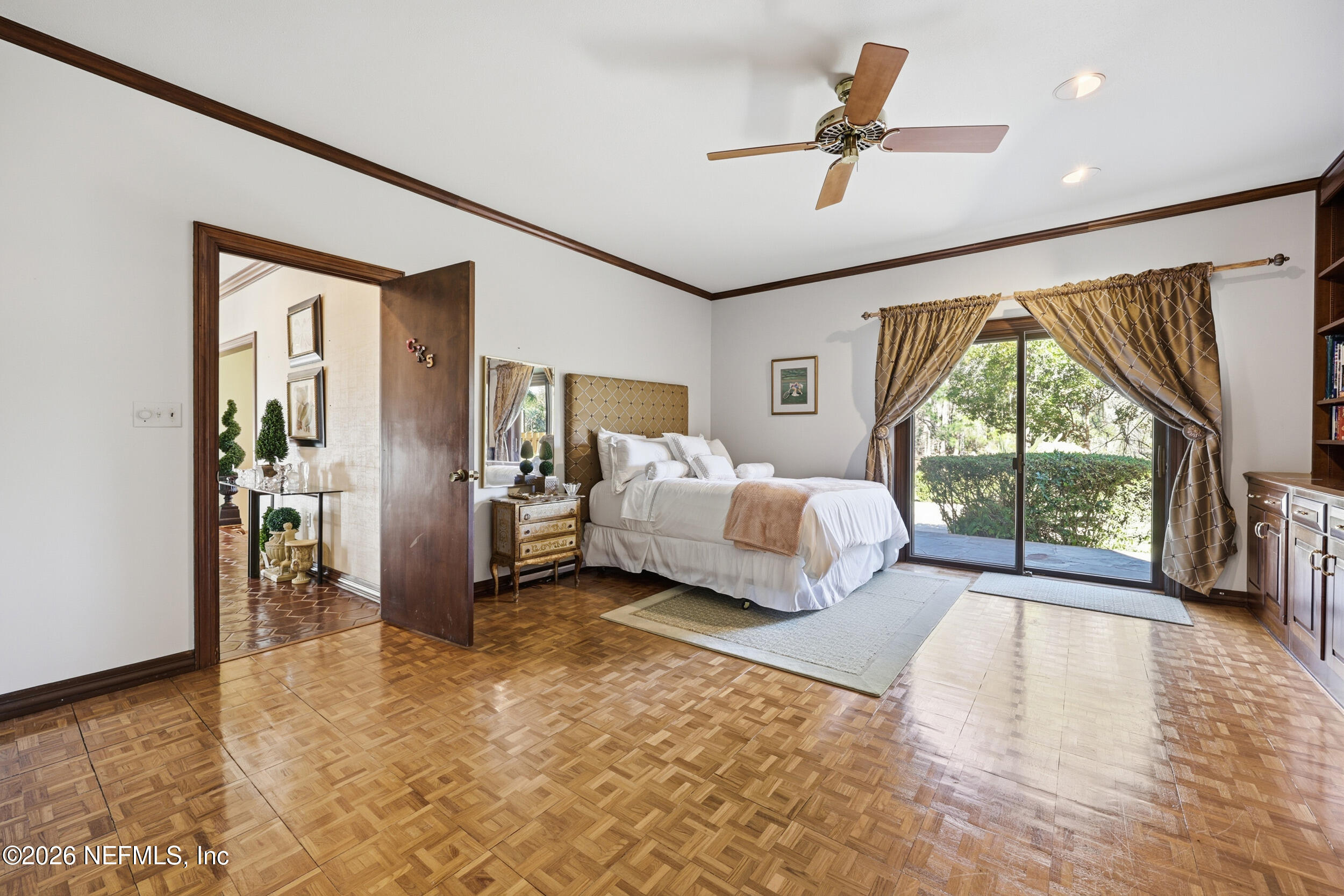 10799 Crosswicks Road Jacksonville, FL 32256 - Photo 24 of 51 a spacious bedroom with a bed and a large window