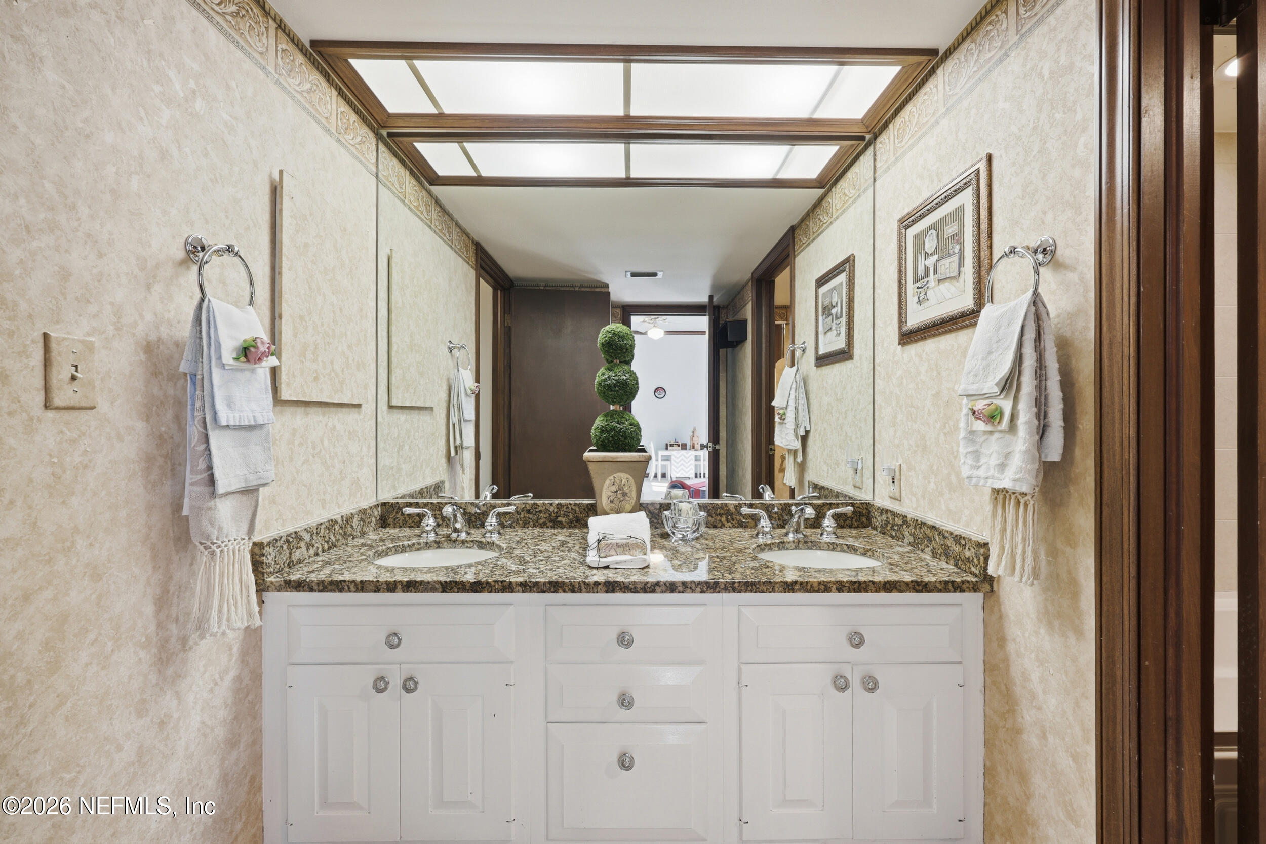 10799 Crosswicks Road Jacksonville, FL 32256 - Photo 25 of 51 a bathroom with a granite countertop sink and a mirror