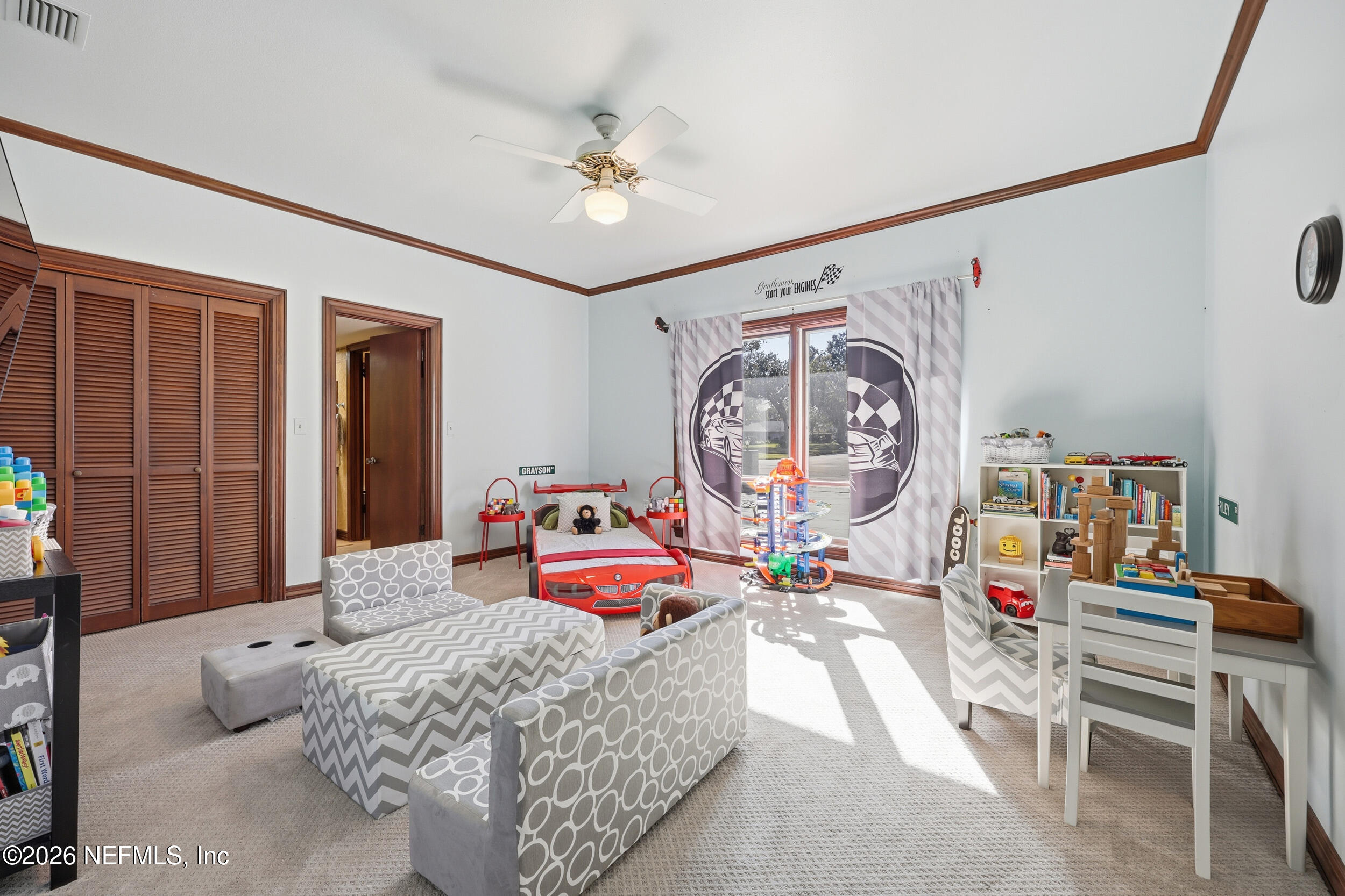 10799 Crosswicks Road Jacksonville, FL 32256 - Photo 28 of 51 a bedroom with furniture and a chandelier