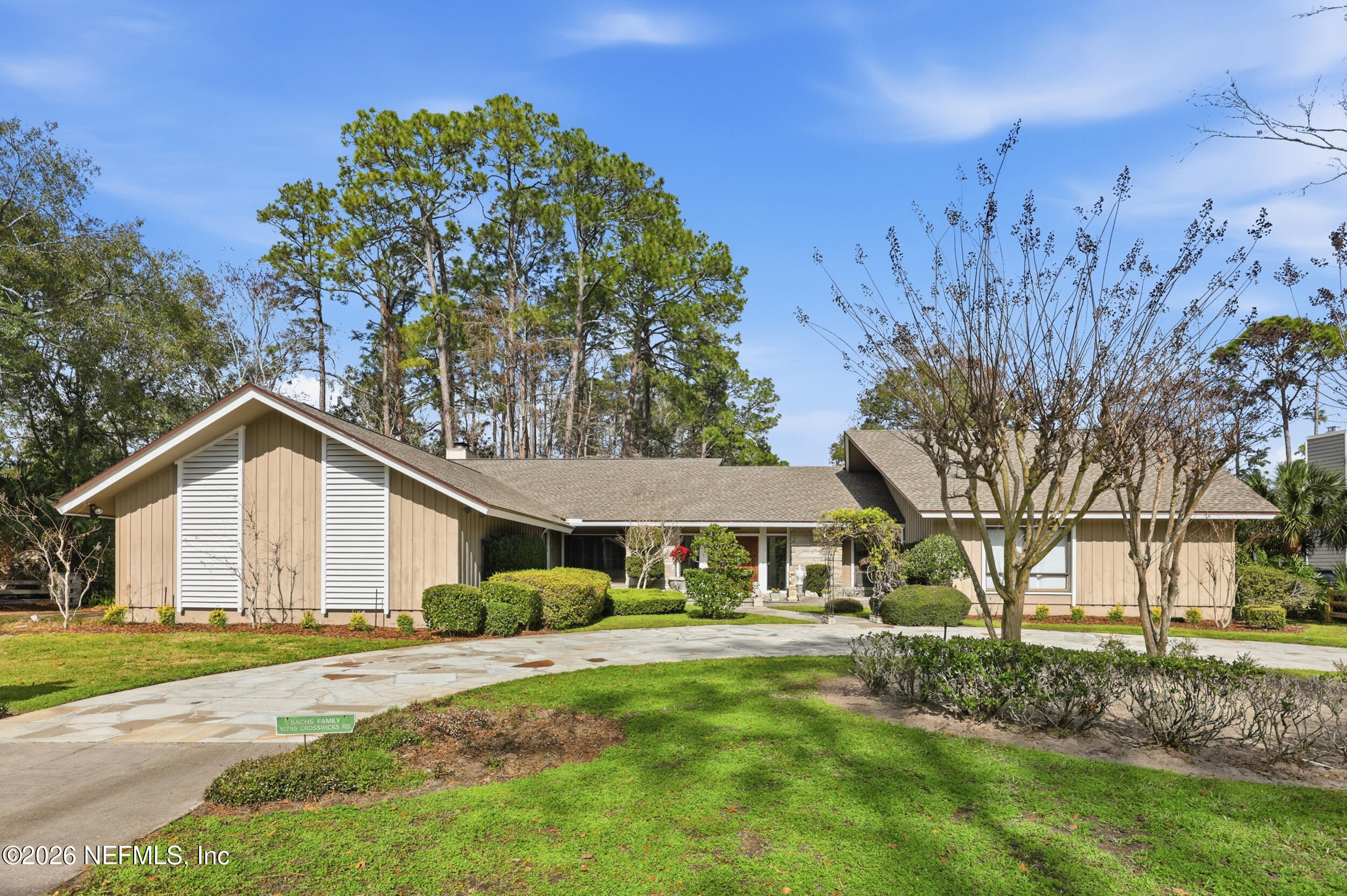 10799 Crosswicks Road Jacksonville, FL 32256 - Photo 35 of 51 a view of a house with a yard