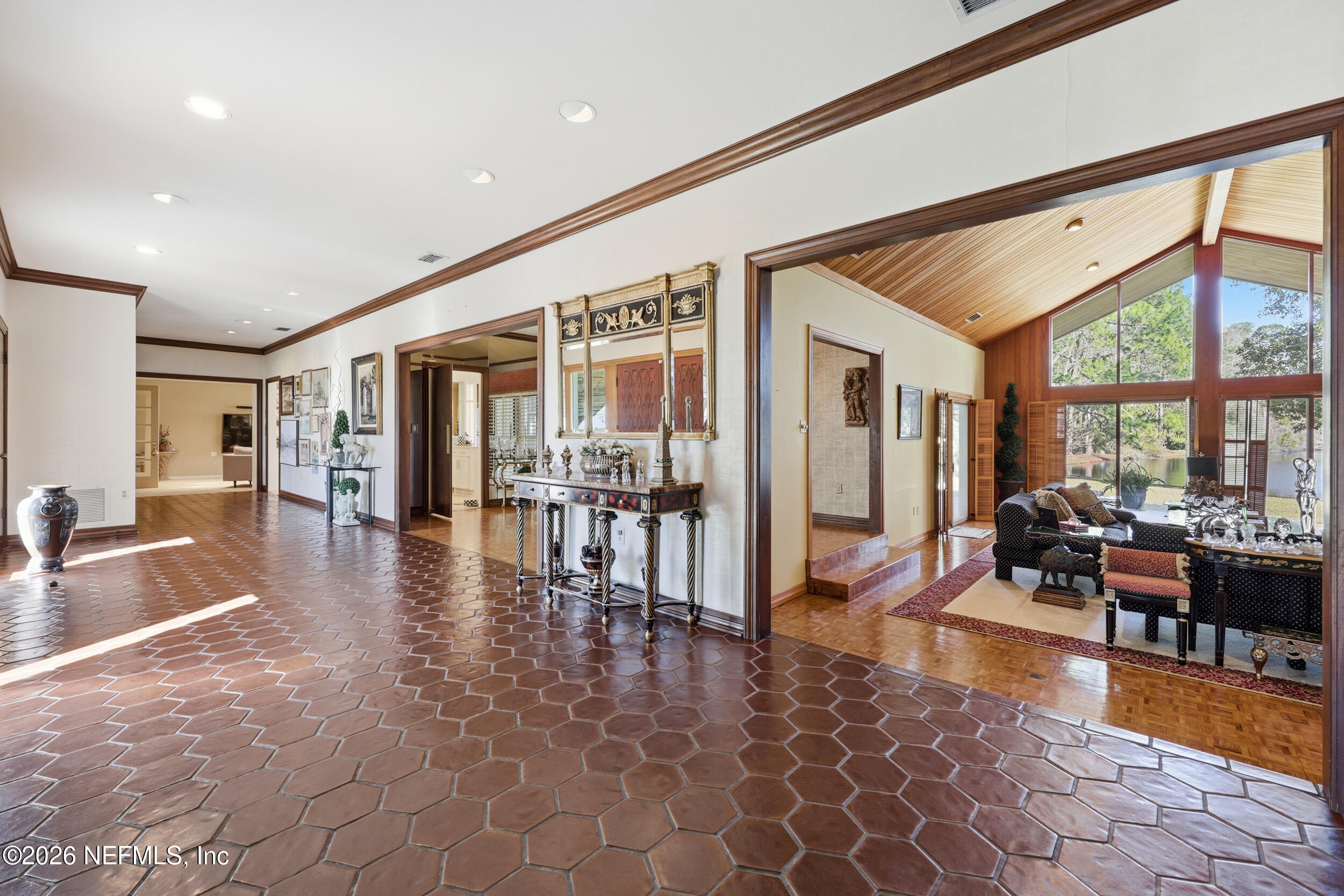 10799 Crosswicks Road Jacksonville, FL 32256 - Photo 4 of 51 a lobby with furniture and wooden floor
