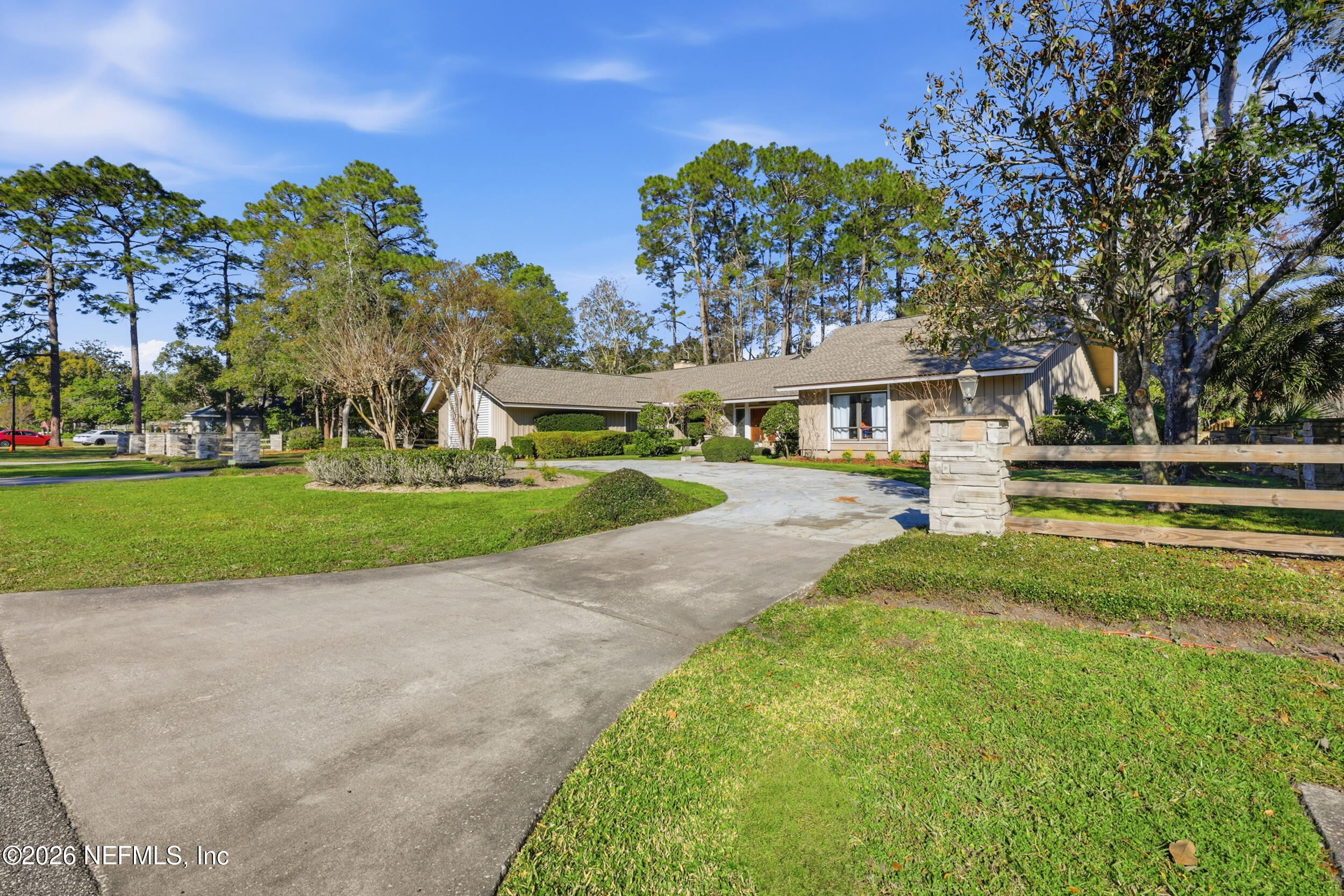 10799 Crosswicks Road Jacksonville, FL 32256 - Photo 44 of 51 a view of a house with a big yard and potted plants