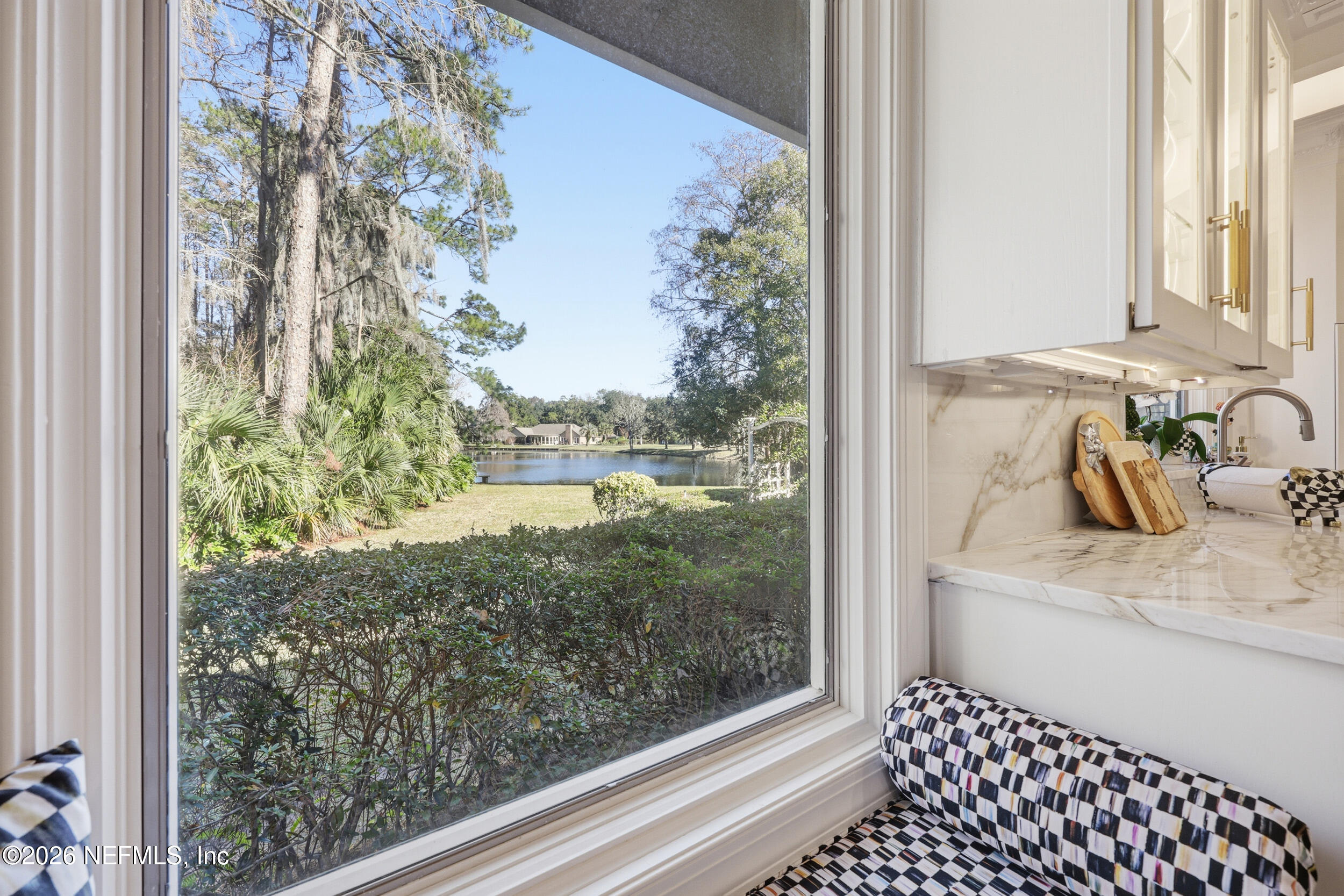 10799 Crosswicks Road Jacksonville, FL 32256 - Photo 49 of 51 a bathroom with a sink and mirror