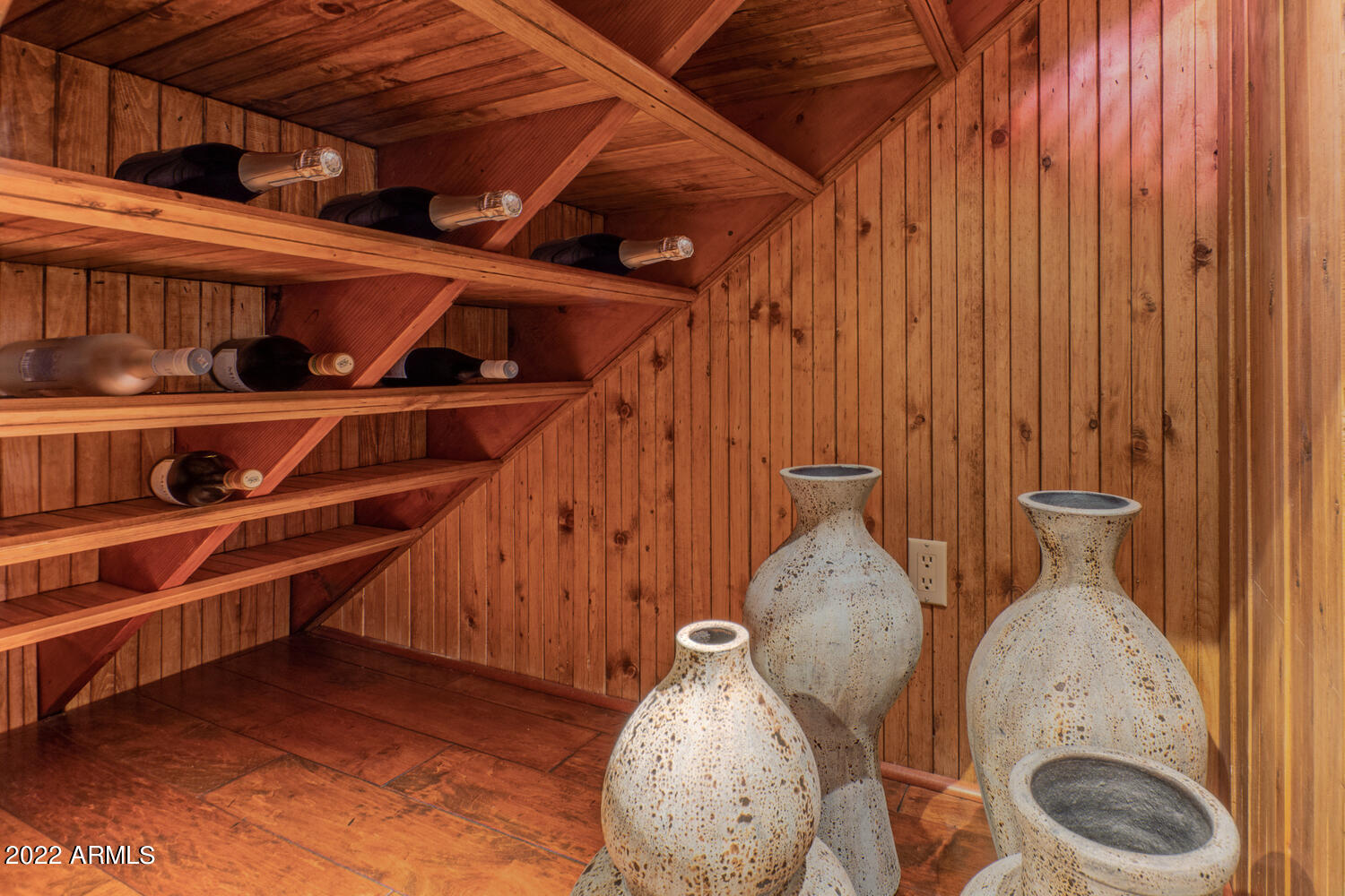 8100 East Camelback Road, Unit 39 Scottsdale, AZ 85251 - Photo 21 of 40 under stairs wine storage by kitchen
