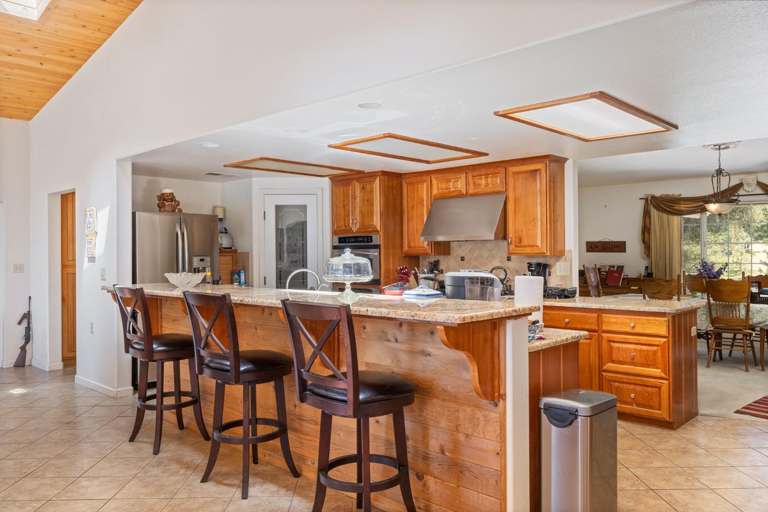 45544 Pine River Road Ahwahnee, CA 93601 - Photo 14 of 75 a dining hall with stainless steel appliances a table and chairs