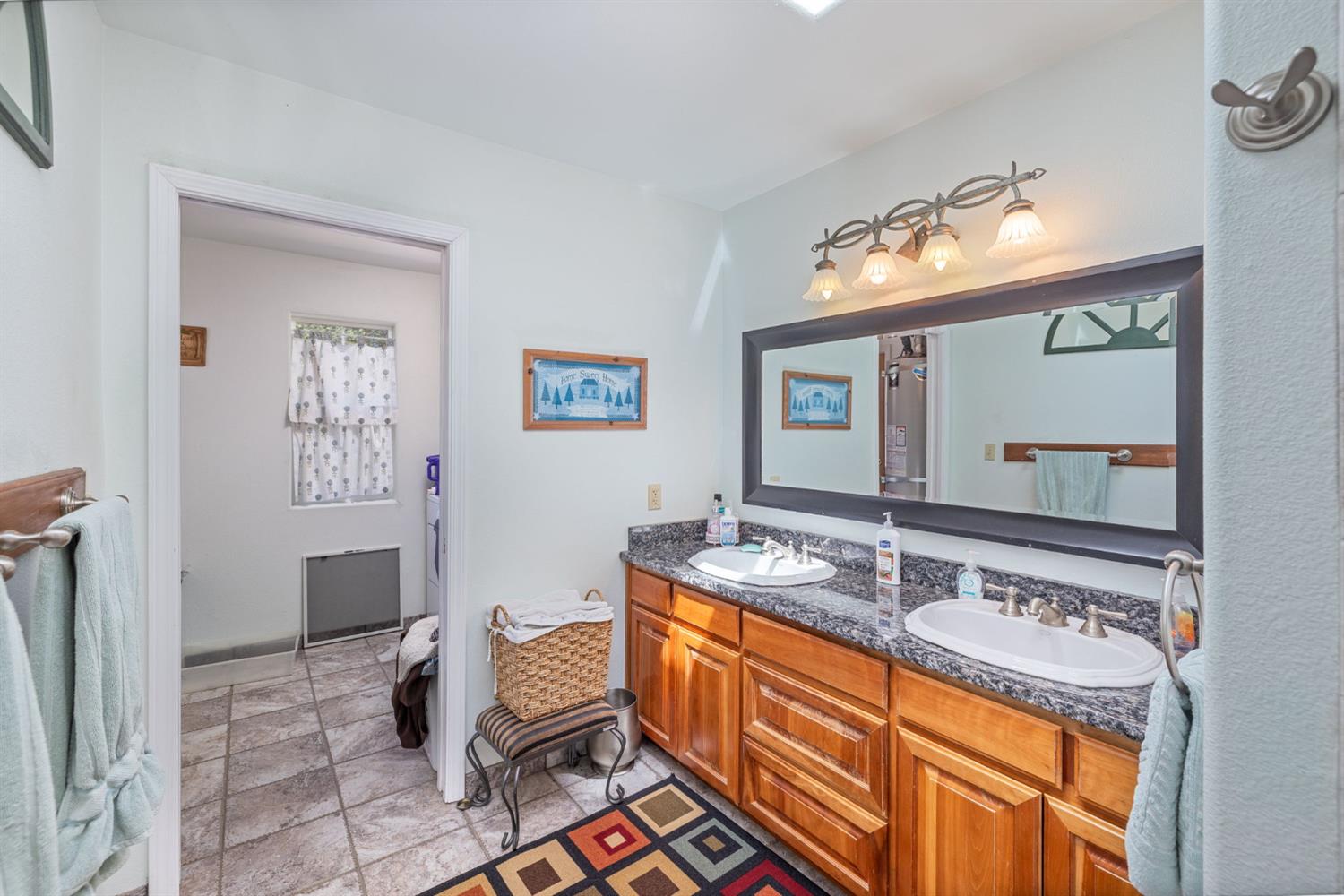 45544 Pine River Road Ahwahnee, CA 93601 - Photo 16 of 75 a bathroom with a sink double vanity and a mirror