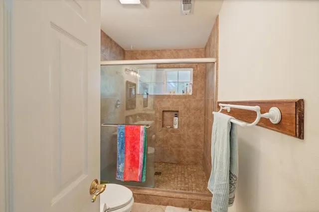 a view of storage and utility room with washer and dryer