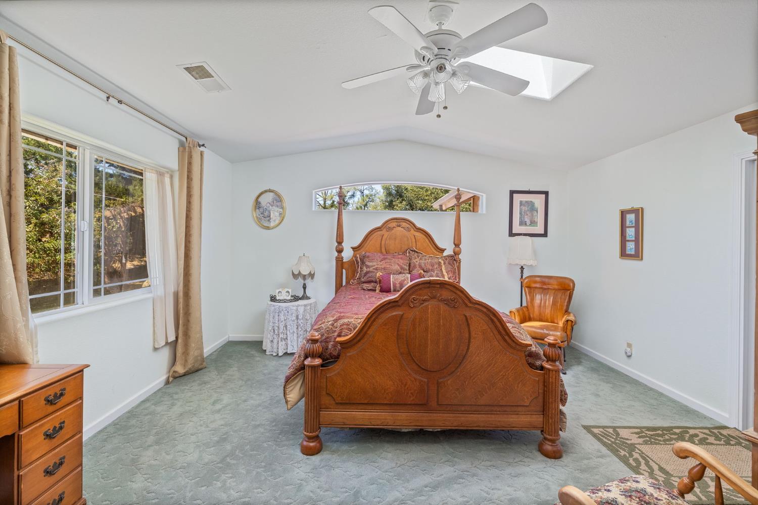 45544 Pine River Road Ahwahnee, CA 93601 - Photo 27 of 75 a bedroom with a bed and a chandelier