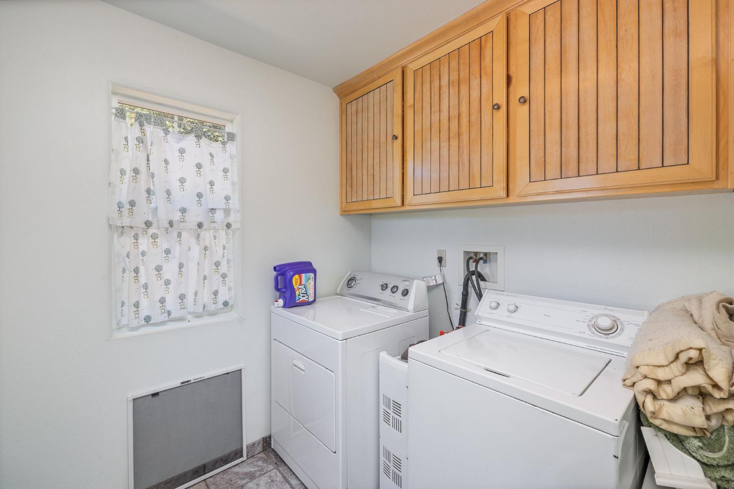 45544 Pine River Road Ahwahnee, CA 93601 - Photo 30 of 75 a view of storage and utility room with washer and dryer