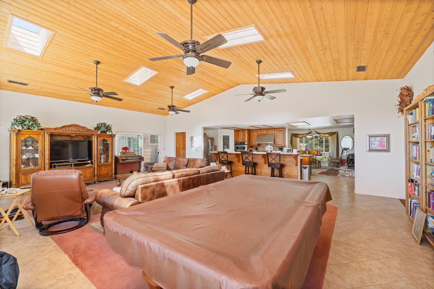 45544 Pine River Road Ahwahnee, CA 93601 - Photo 3 of 75 a living room with furniture a flat screen tv and a ceiling fan