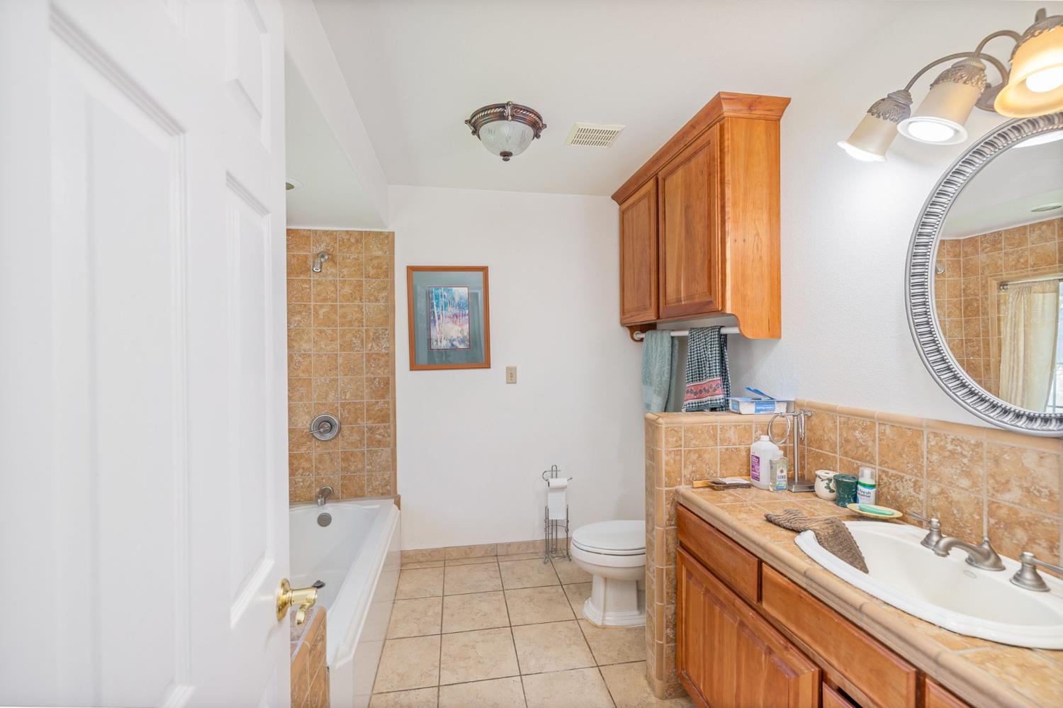 45544 Pine River Road Ahwahnee, CA 93601 - Photo 35 of 75 a bathroom with a sink a toilet and a mirror