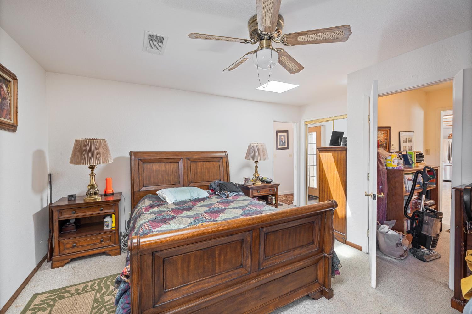 45544 Pine River Road Ahwahnee, CA 93601 - Photo 39 of 75 a bedroom with a bed and a chandelier