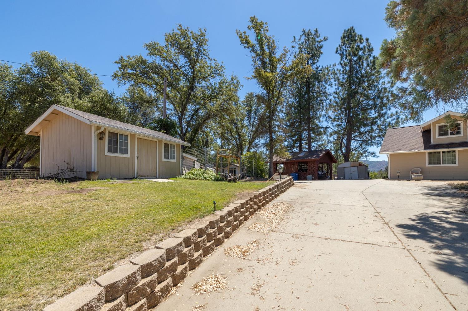 45544 Pine River Road Ahwahnee, CA 93601 - Photo 42 of 75 a view of a house with a yard and tree s