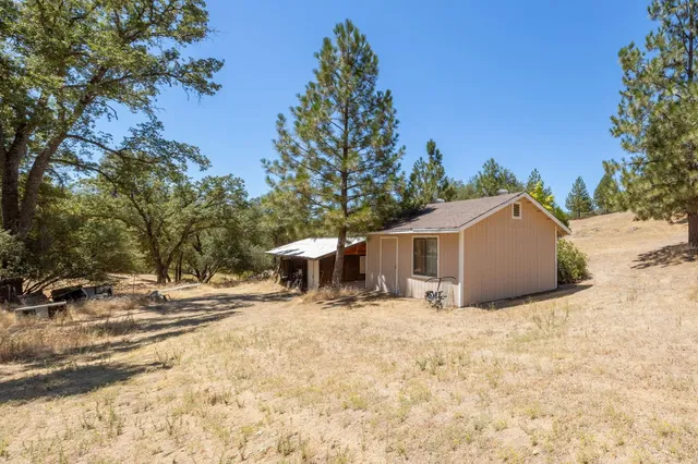 a view of a house with a snow in the background
