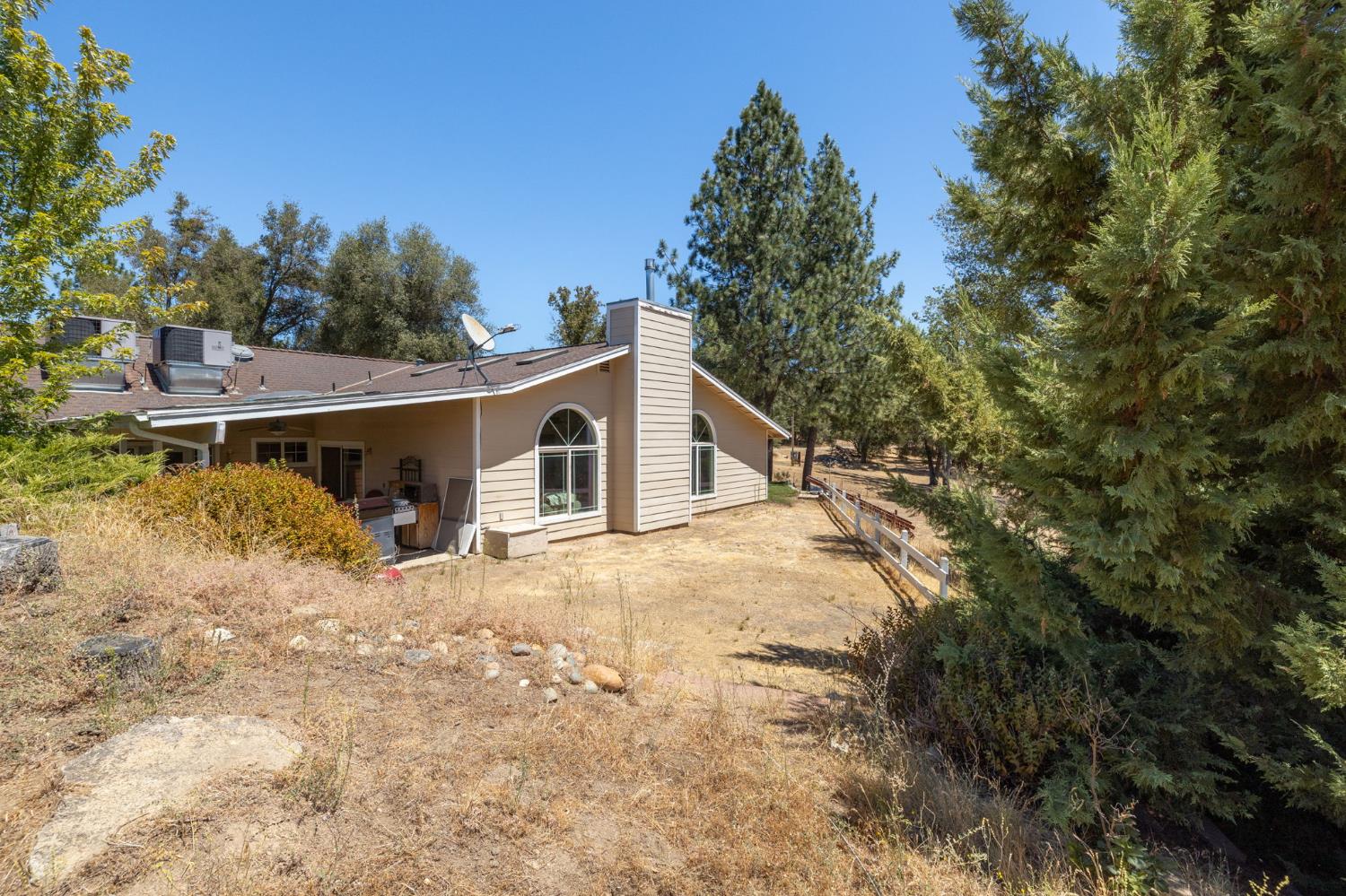 45544 Pine River Road Ahwahnee, CA 93601 - Photo 56 of 75 a view of a house with a yard