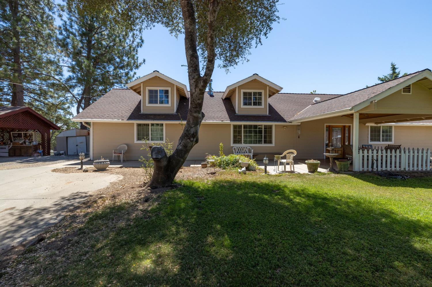 45544 Pine River Road Ahwahnee, CA 93601 - Photo 67 of 75 a front view of a house with yard and green space