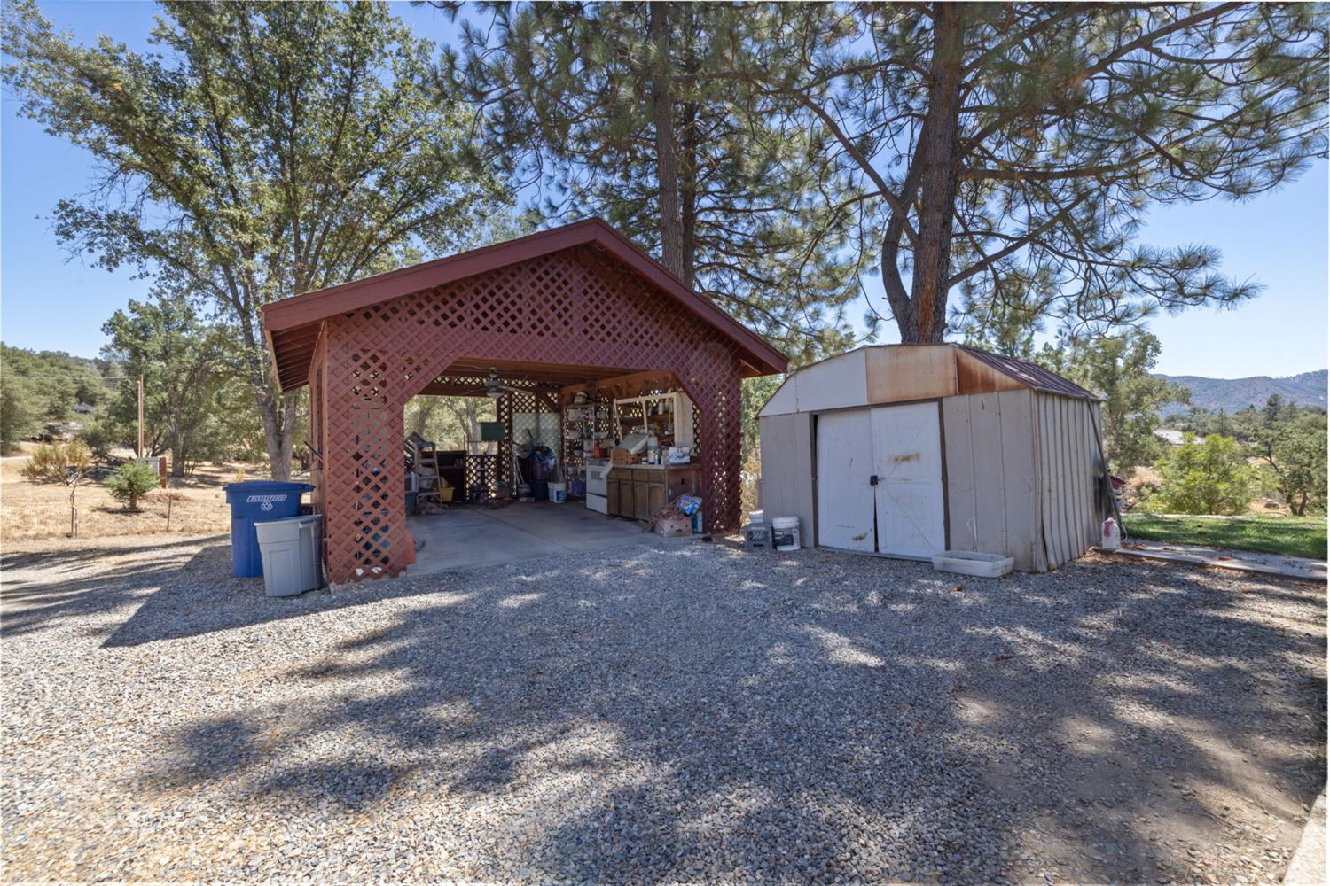 45544 Pine River Road Ahwahnee, CA 93601 - Photo 75 of 75 a view of a house with a yard and garage