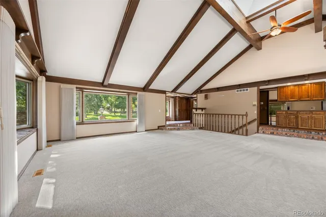 a view of a room that has a large window