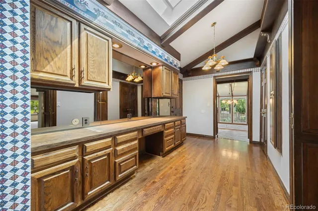 a view of a kitchen with stainless steel appliances granite countertop a refrigerator and a sink