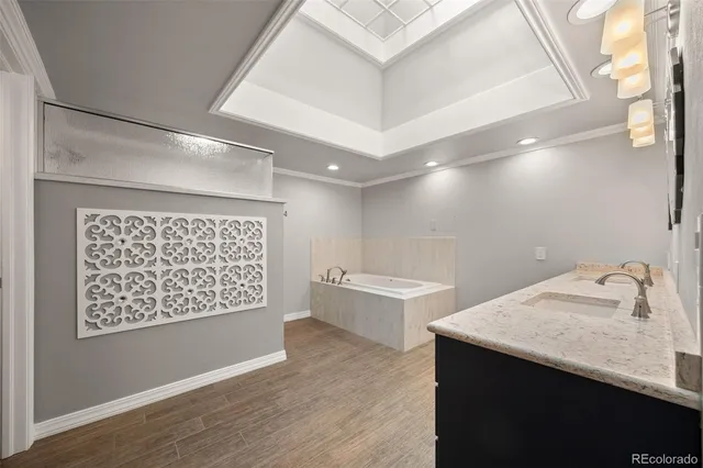 a bathroom with a double vanity sink and a mirror