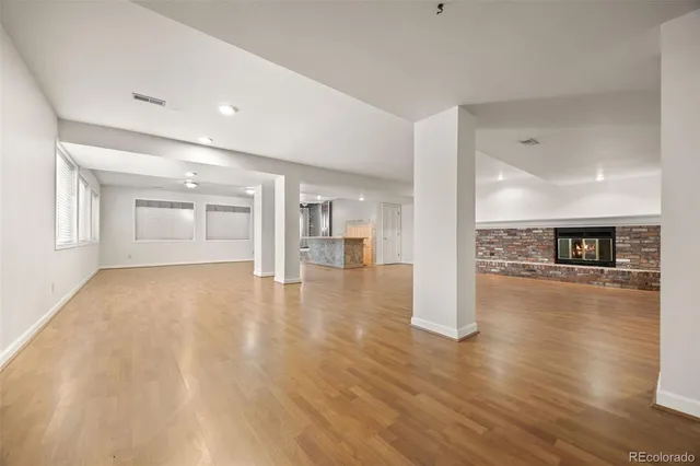 a living room with a fireplace and a flat screen tv