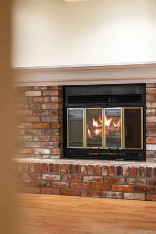a view of empty room with a kitchen